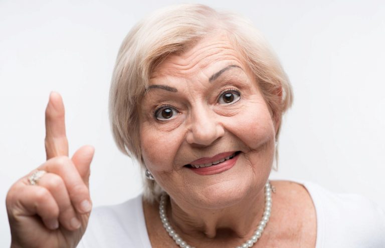 Elderly lady is shaking her finger